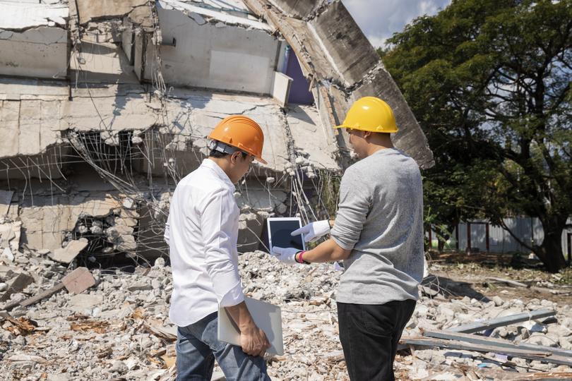 A demolition crew safely dismantling a building