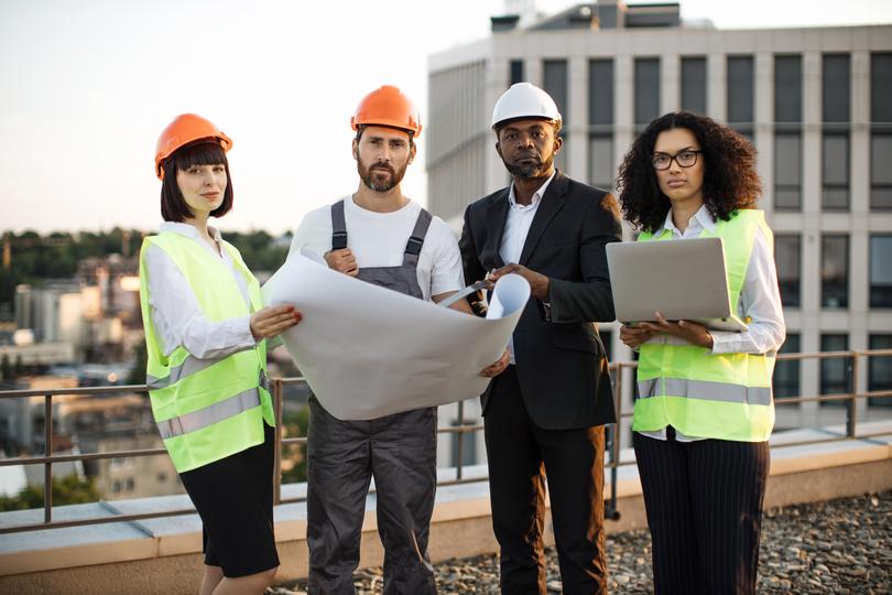 Construction workers building a new house