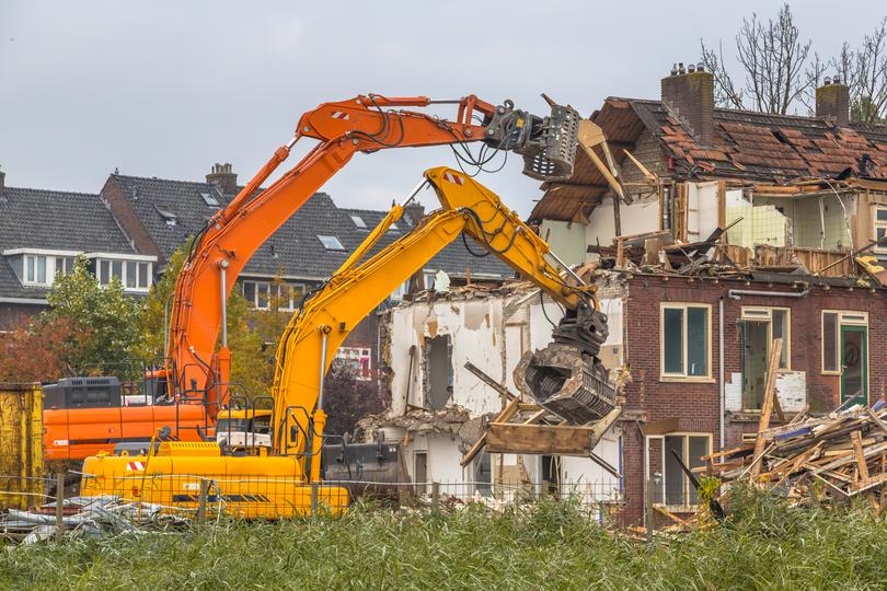 A demolition crew safely dismantling a building