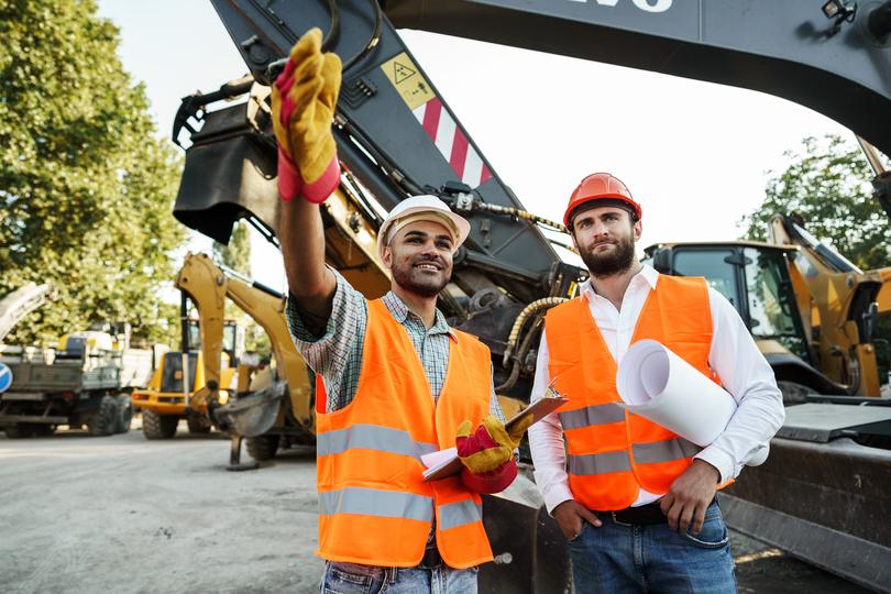 An excavator clearing land for a construction project